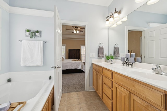 bathroom with tile patterned floors, double vanity, a sink, and ensuite bathroom