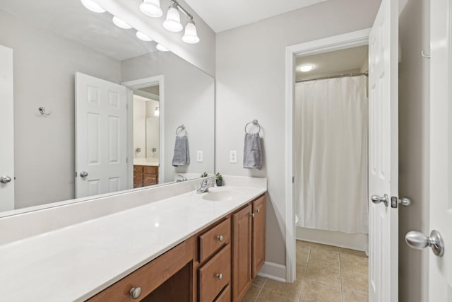 bathroom with baseboards, tile patterned flooring, vanity, and a shower with curtain