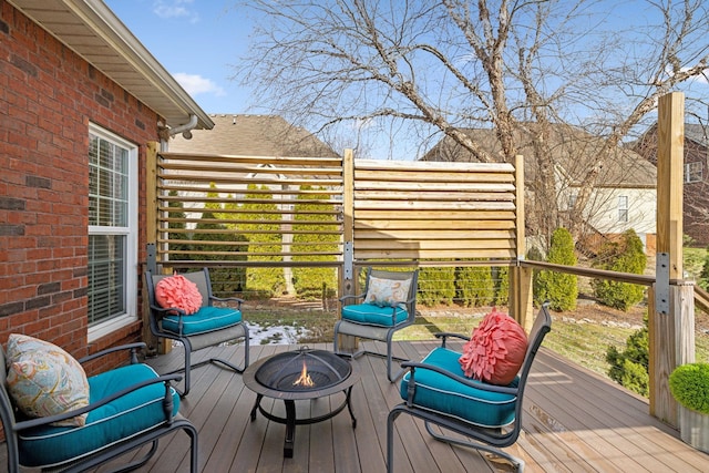 deck with an outdoor fire pit