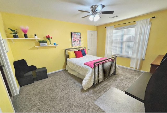 bedroom with carpet floors, a ceiling fan, visible vents, and baseboards