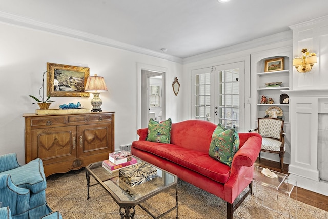 living room with french doors, hardwood / wood-style floors, and ornamental molding