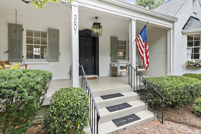 entrance to property with a porch