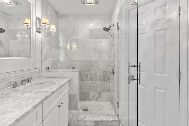 bathroom with vanity and walk in shower