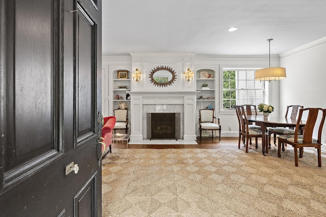 living room with a fireplace and ornamental molding