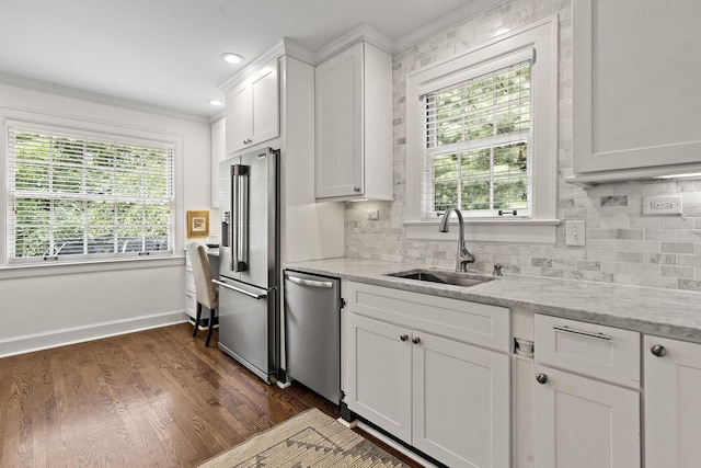 kitchen featuring white cabinets, sink, dark hardwood / wood-style floors, appliances with stainless steel finishes, and light stone counters