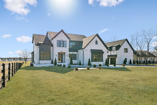 modern farmhouse style home featuring a front lawn