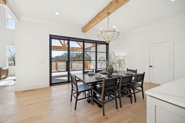 dining area featuring an inviting chandelier, beam ceiling, light hardwood / wood-style floors, and crown molding