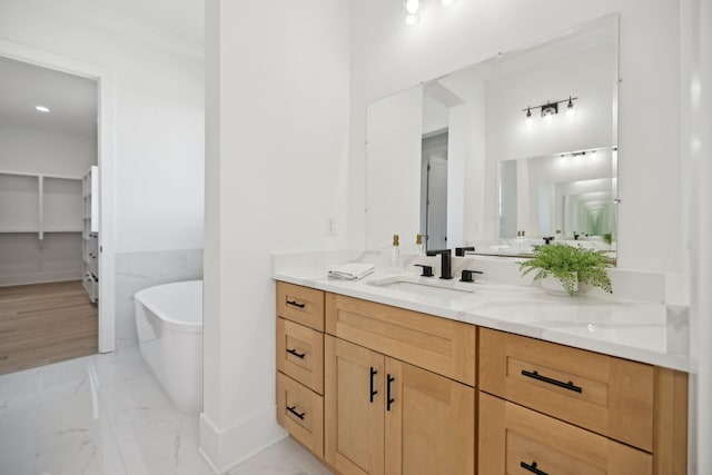 bathroom with vanity and a tub to relax in