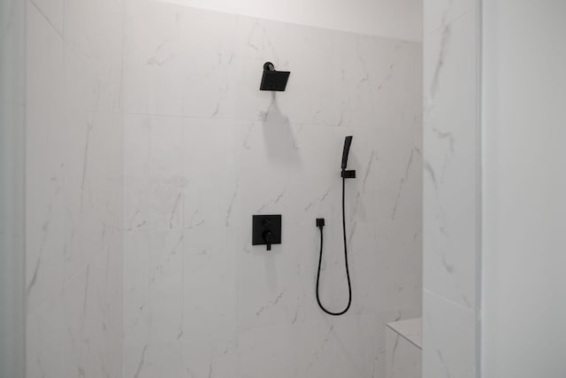 details featuring a tile shower