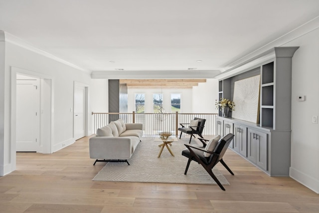 living room featuring crown molding and light wood-type flooring