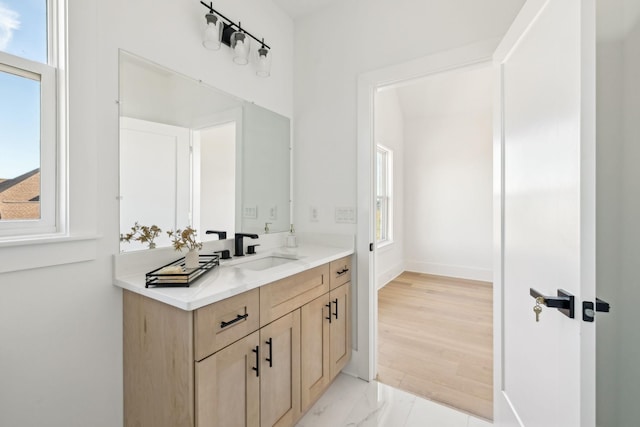 bathroom with vanity and plenty of natural light