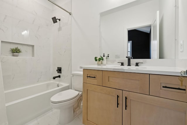 full bathroom featuring tiled shower / bath combo, vanity, and toilet