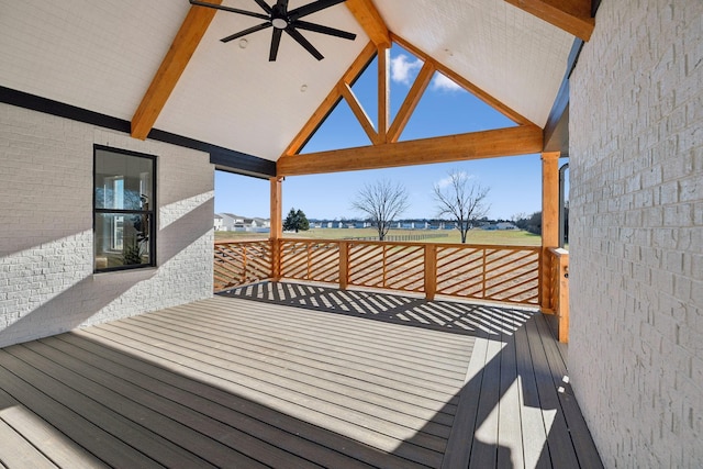 wooden terrace with a gazebo and ceiling fan