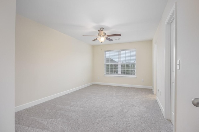 empty room with light carpet and ceiling fan