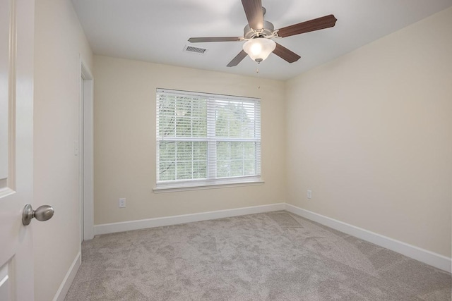 carpeted empty room with ceiling fan