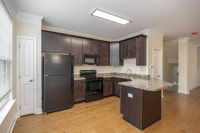 kitchen featuring black appliances, kitchen peninsula, light hardwood / wood-style flooring, ornamental molding, and dark brown cabinetry