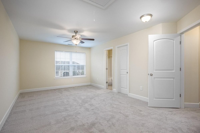 unfurnished bedroom featuring ceiling fan and light colored carpet