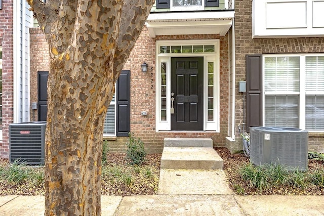 doorway to property featuring central AC unit