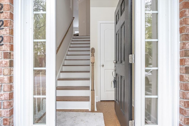 stairs featuring wood-type flooring