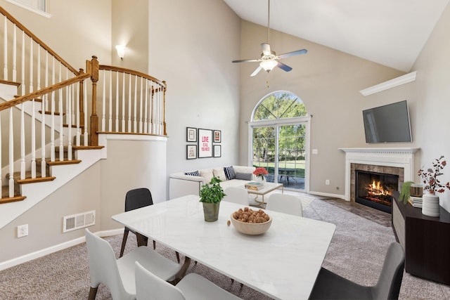 2016 Shamrock Dr, Spring Hill, TN 37174 - carpeted dining space with stairs, a ceiling fan, high vaulted ceiling, and a fireplace