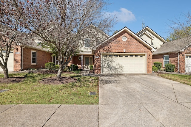 view of front of property featuring a garage and a front lawn