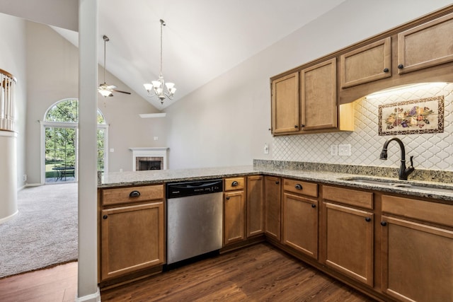 2016 Shamrock Dr, Spring Hill, TN 37174 - kitchen featuring vaulted ceiling, dishwasher, tasteful backsplash, a peninsula, and light stone counters