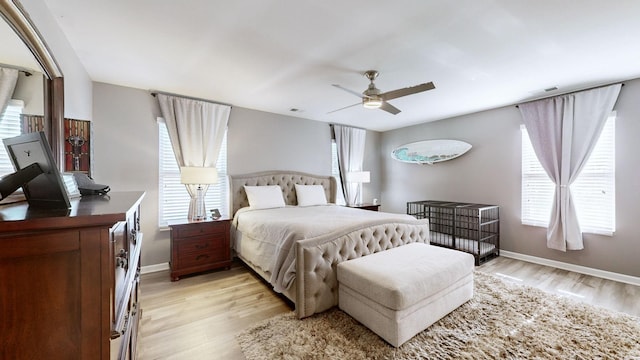 bedroom with light wood-type flooring and ceiling fan