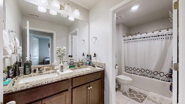 full bathroom featuring toilet, vanity, shower / bath combo, and tile patterned flooring