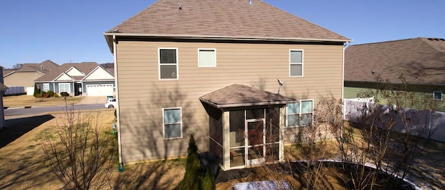 back of house with a sunroom