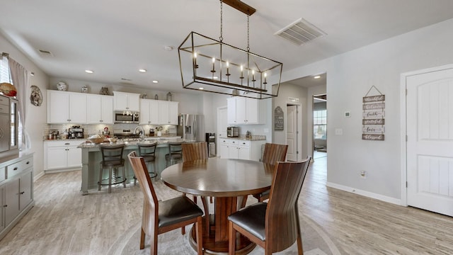 dining room featuring light hardwood / wood-style floors