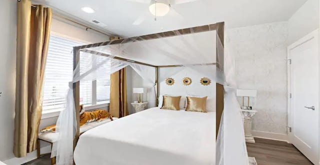 bedroom featuring ceiling fan and dark wood-type flooring