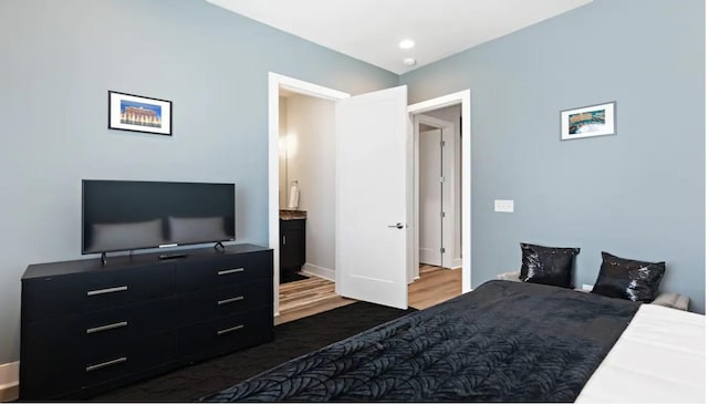 bedroom featuring dark wood-style flooring