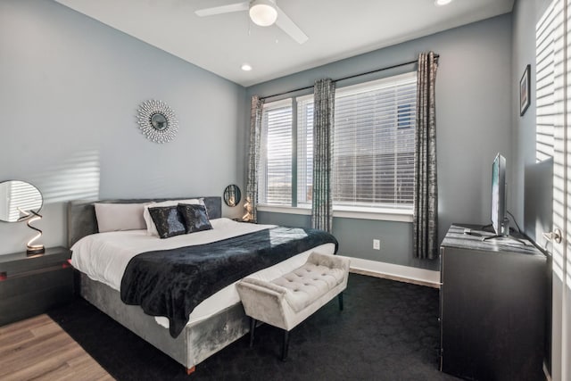 bedroom featuring recessed lighting, wood finished floors, baseboards, and ceiling fan