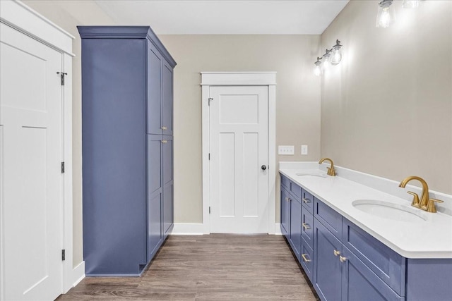 bathroom with vanity and hardwood / wood-style flooring