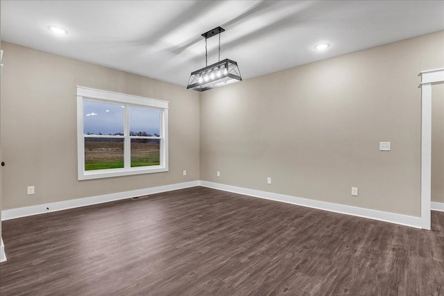 unfurnished dining area with dark hardwood / wood-style flooring