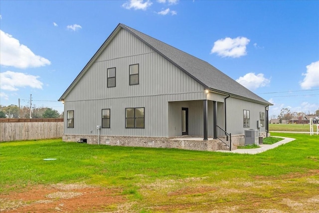 back of property featuring a yard and cooling unit