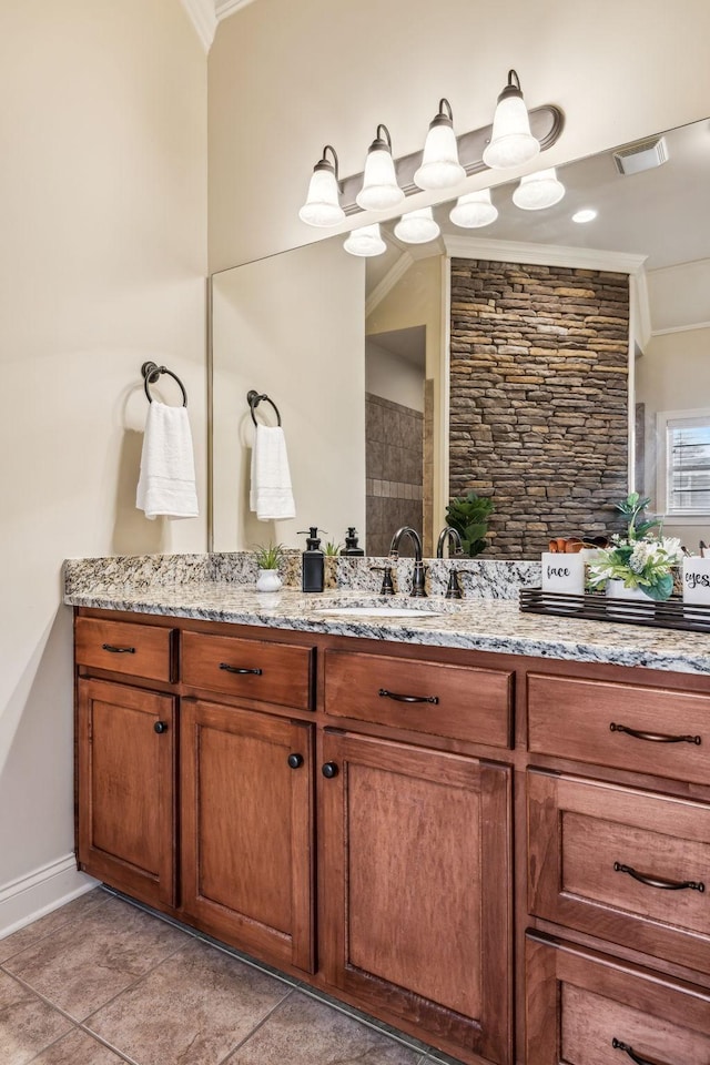 bathroom with crown molding and vanity