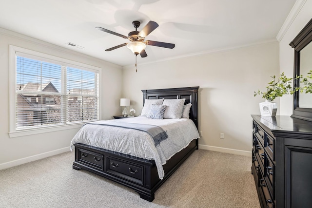 carpeted bedroom featuring ceiling fan and ornamental molding