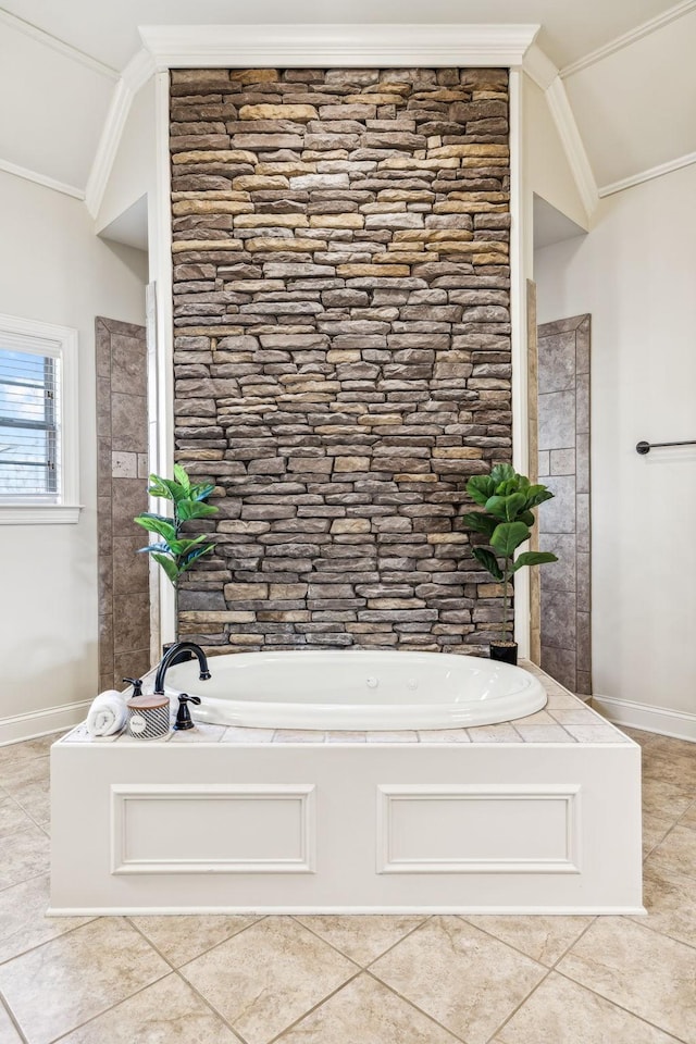 bathroom with tile patterned flooring, vaulted ceiling, and a tub