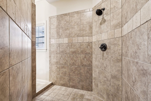 bathroom with tiled shower