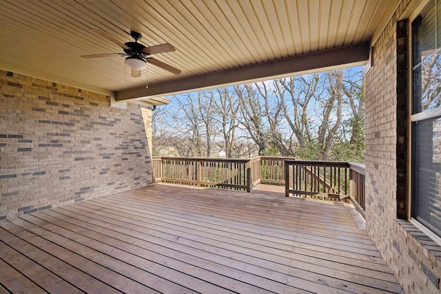 wooden deck featuring ceiling fan