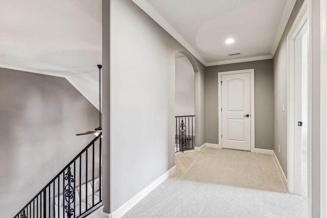 hallway featuring carpet and crown molding