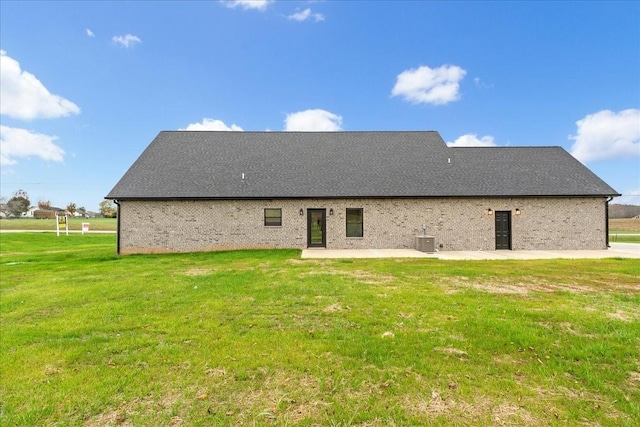 back of house with a patio, cooling unit, and a lawn