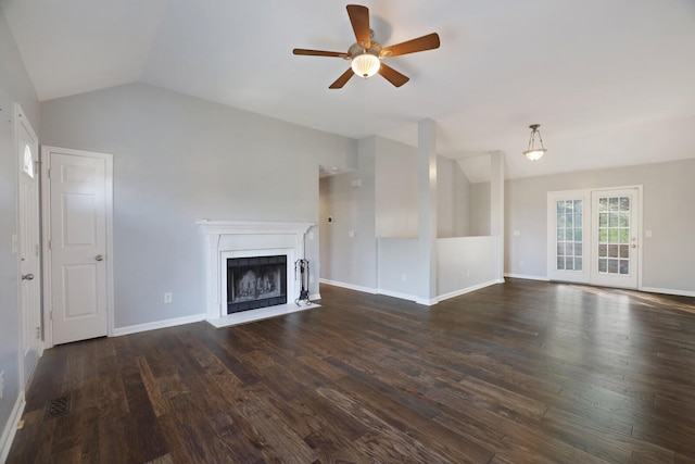 unfurnished living room featuring ceiling fan, dark wood-type flooring, and lofted ceiling