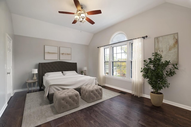 bedroom with ceiling fan, dark hardwood / wood-style floors, and vaulted ceiling