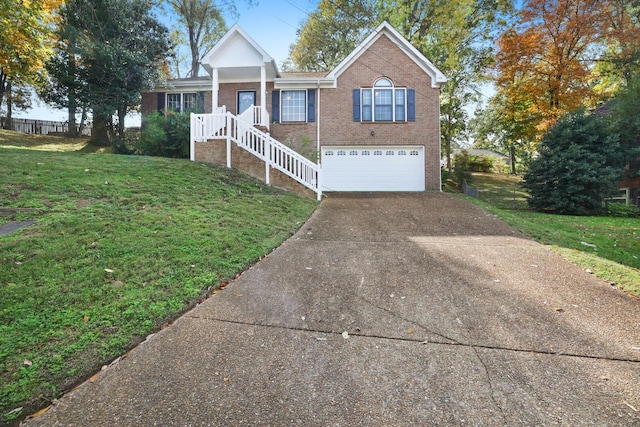 view of front of property featuring a front lawn and a garage