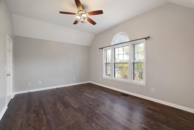 unfurnished room with ceiling fan, dark wood-type flooring, and vaulted ceiling