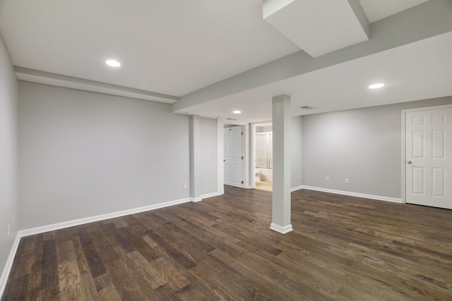 basement featuring dark hardwood / wood-style floors