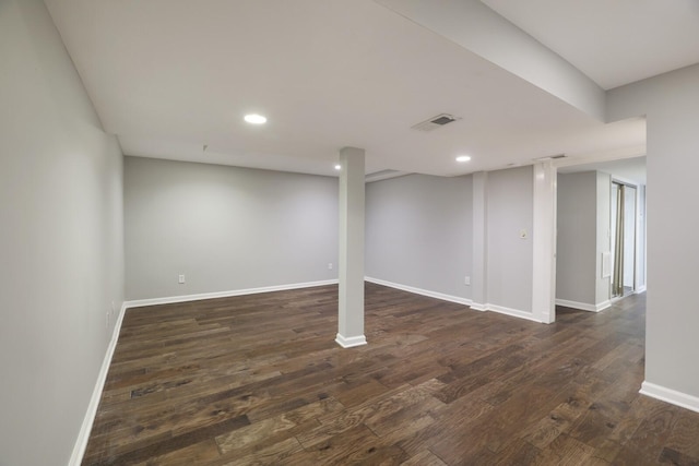 basement featuring dark hardwood / wood-style floors