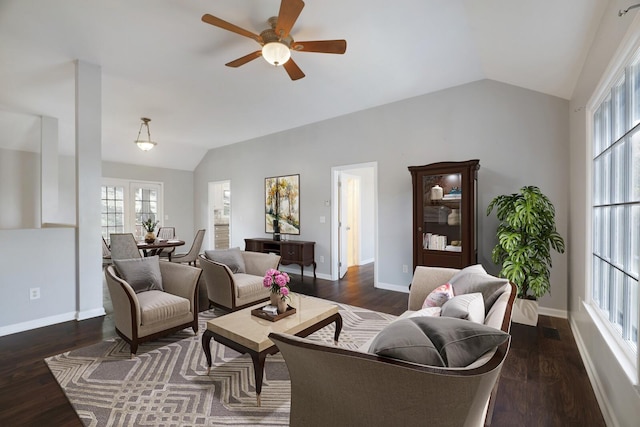 living room with ceiling fan, dark hardwood / wood-style flooring, and vaulted ceiling